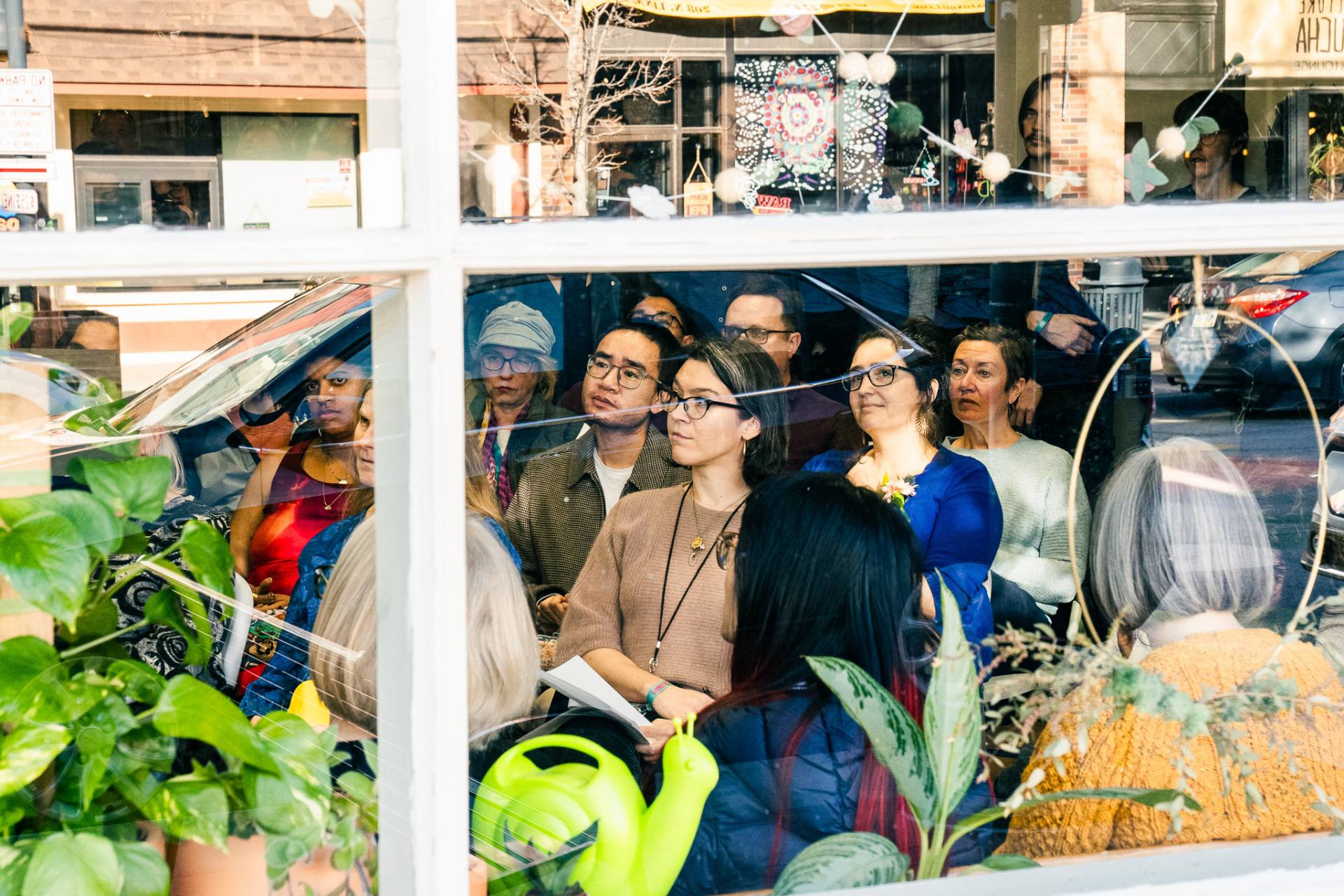 crowd enjoying readings at local flower shop, Willow & Stock. Photo by Alyssa Leicht.